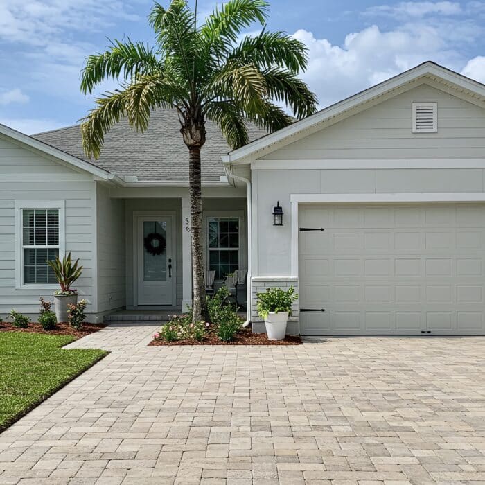 Light,Grey,House,With,White,Trim,,Palm,Tree,,Landscaped,Yard,