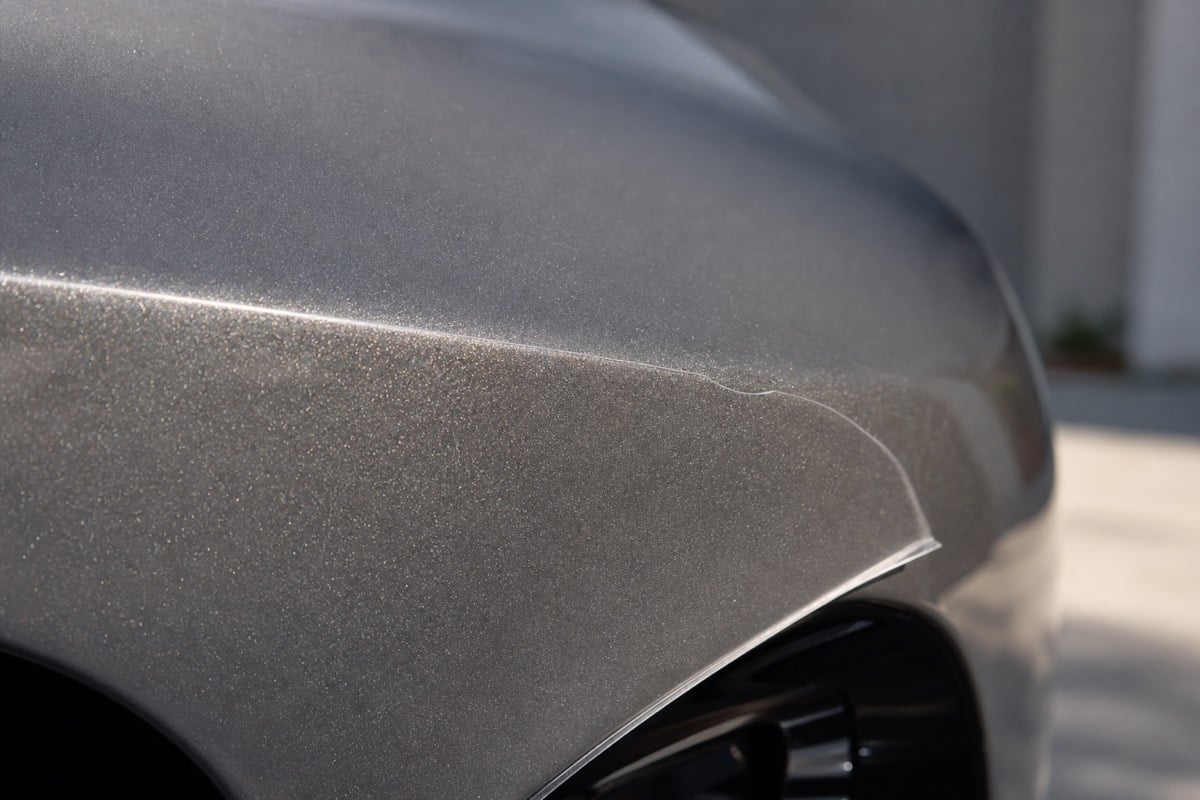 Clear paint protection film edge on a car body panel