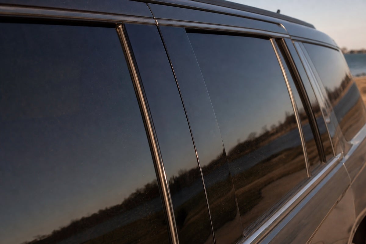Dark ceramic-tinted car windows on a parked vehicle