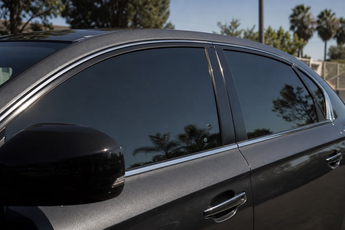 Car door window with freshly applied dark tint